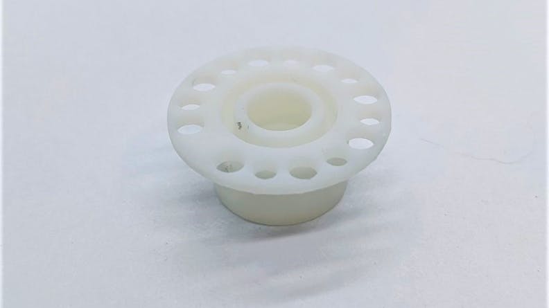 This is the 3D printed Somos PerFORM insulator.