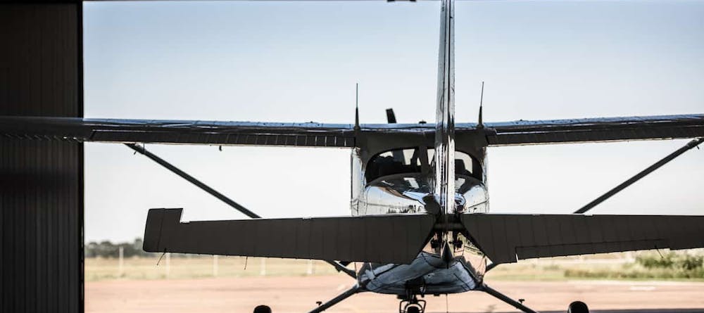 propeller aircraft rear view in a hangar