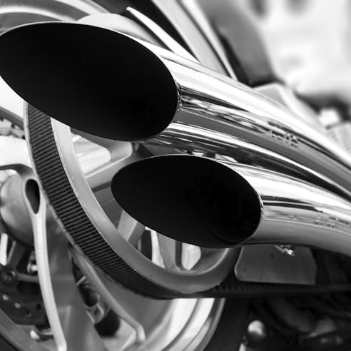 Bent tubes of a motorbike exhaust system. Image credit mblach.