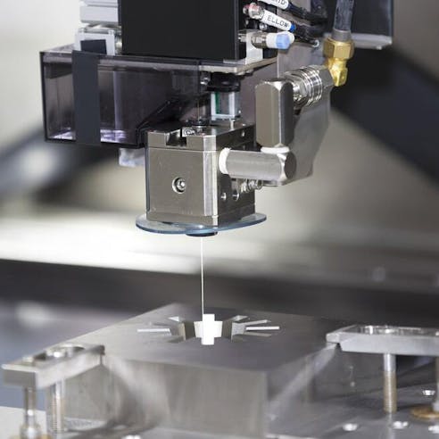 CNC wire cut machine making high-precision molded parts. Image Credit: Shutterstock.com/Aumm graphixphoto